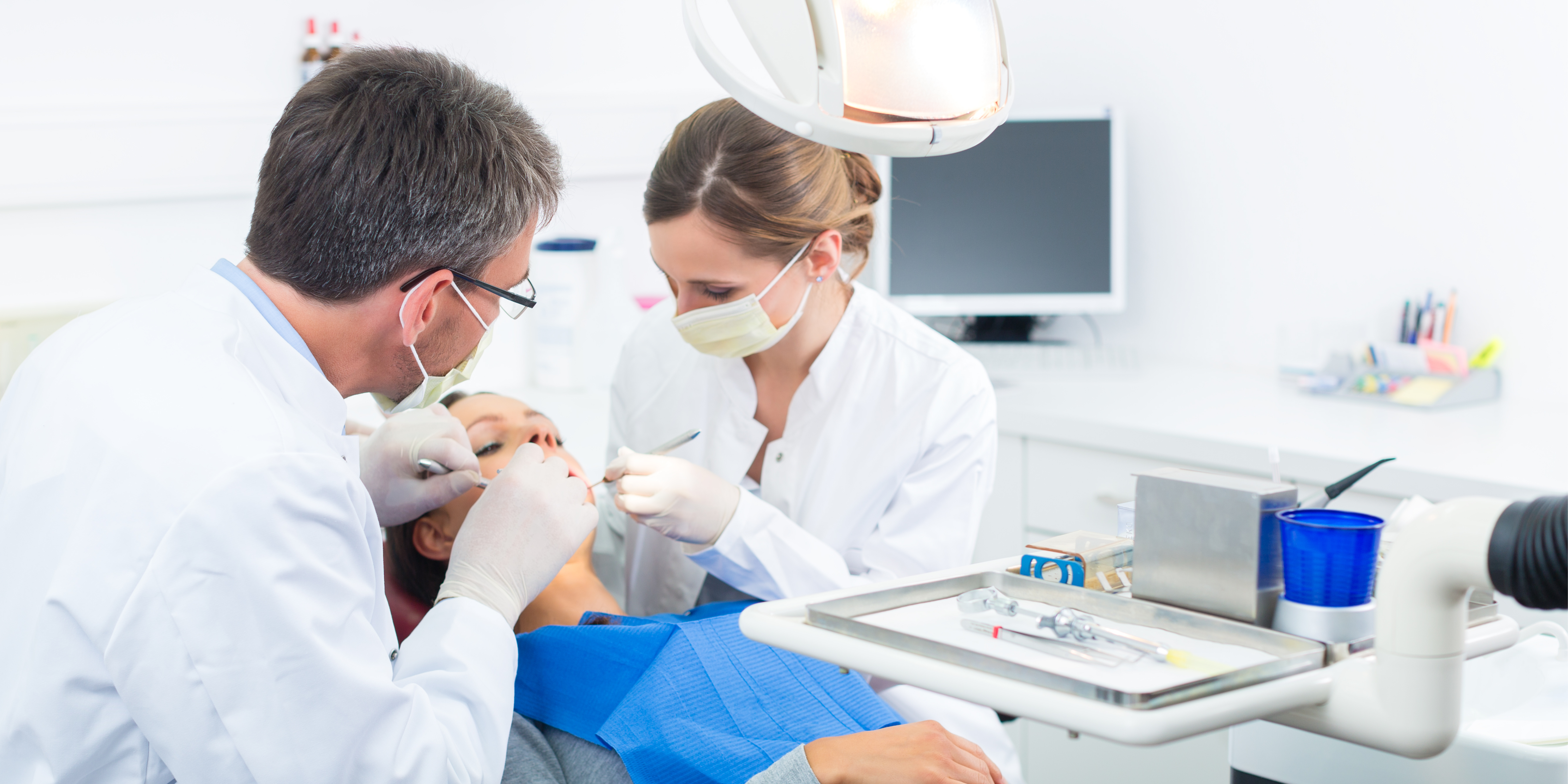 Dental assistant working with patient