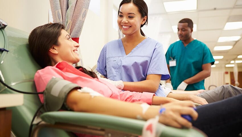 Student medical assistant helping a patient