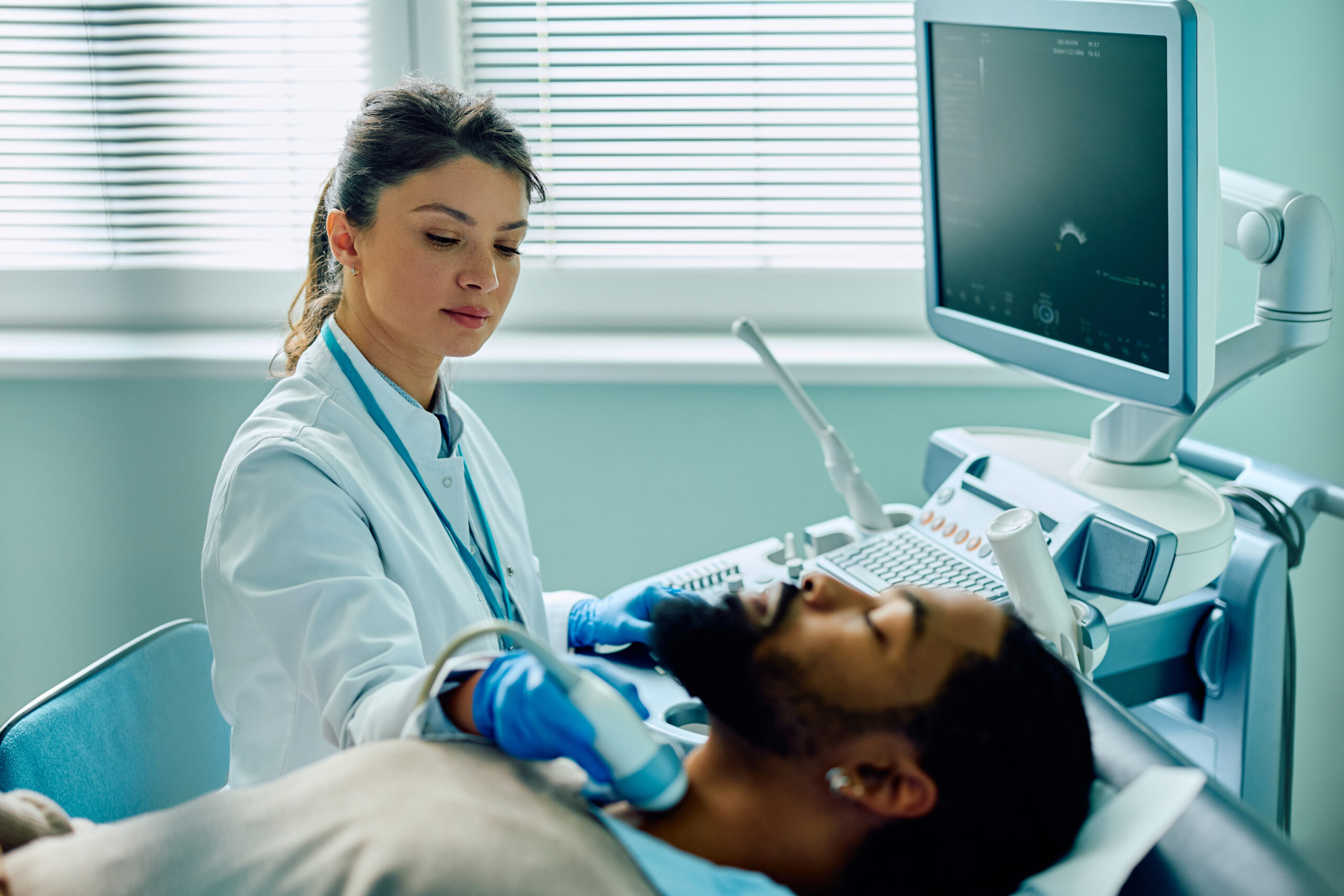 Diagnostic Medical Sonographer with a patient